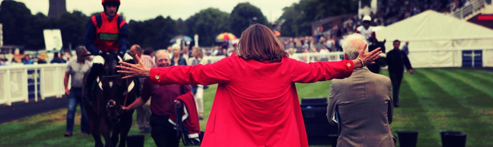 Racegoer enjoying a win while at the Worcester Racecourse.