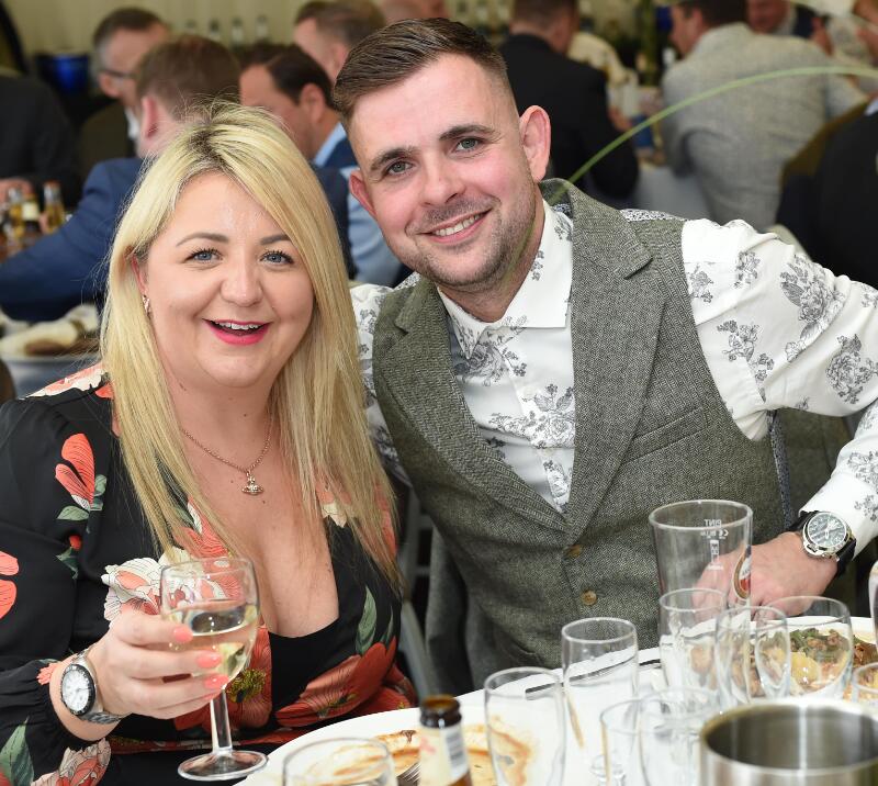 A couple enjoying their race day hospitality table.