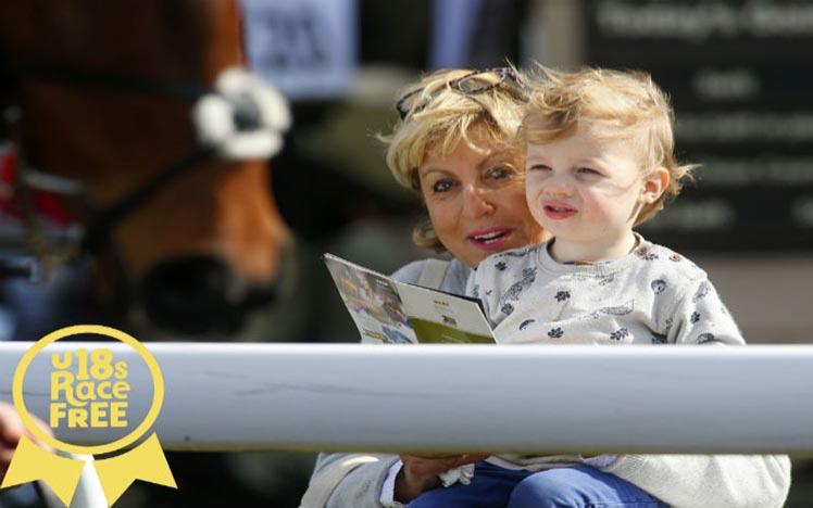 A mother and child enjoy a dasy racing