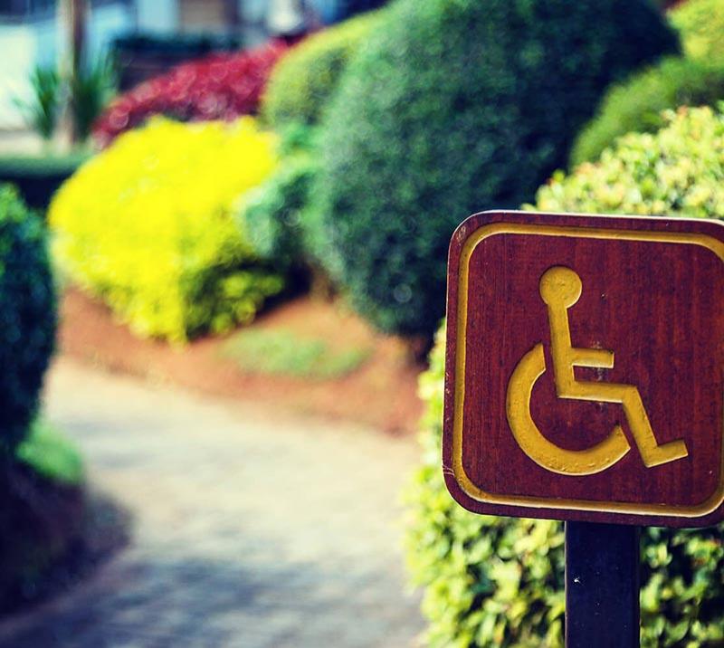 Accessibility sign next to a path at Worcester Racecourse.