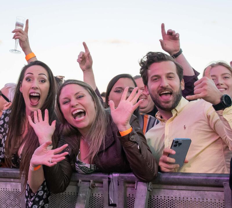 A group of friends gathered at the stage barrier at Worcester Races